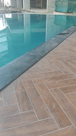 Pool reflects construction site in Kolhapur, India