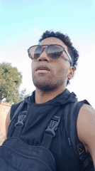 Man in black walks through Porlamar streets Sunday evening