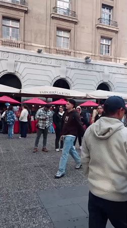 Evening street life and cultural activities observed in Santiago