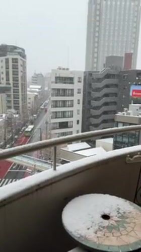 Snow falls over Shibuya district, observed from balcony