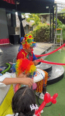 Clowns making balloons at an outdoor event in Porlamar