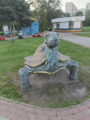 Concrete dinosaur and animal statues in a Sumy park