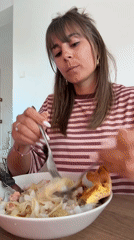 Woman dines at restaurant in Cannes, France