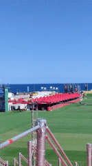 Seaside concert venue prepared for festival under clear skies