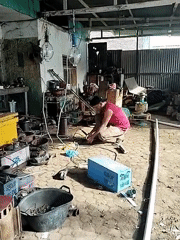 Man works with tools in Lhokseumawe garage workshop