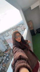 Woman films selfie video from high-rise balcony in Khimki