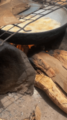 Outdoor cooking observed over open fire in Minna, Nigeria