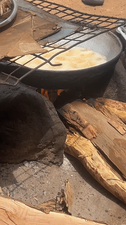 Outdoor cooking observed over open fire in Minna, Nigeria