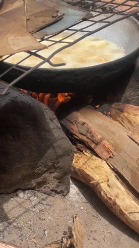 Outdoor cooking observed over open fire in Minna, Nigeria