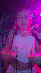 Woman takes selfie in colorful nightclub in Varna