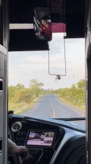 Passenger records dashboard view from moving vehicle in Vietnam
