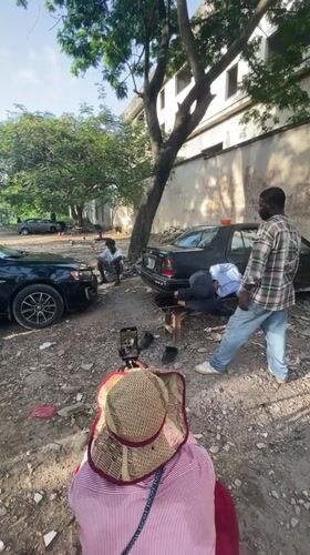 Outdoor barbering session filmed in Ikoyi, Nigeria