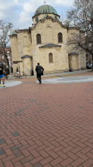 Historic plaza with green-domed building documented in Varna, Bulgaria