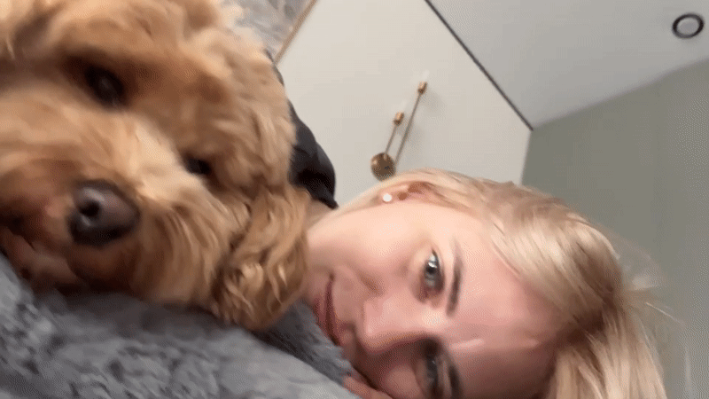 Woman and dog share quiet morning moment in Saratov