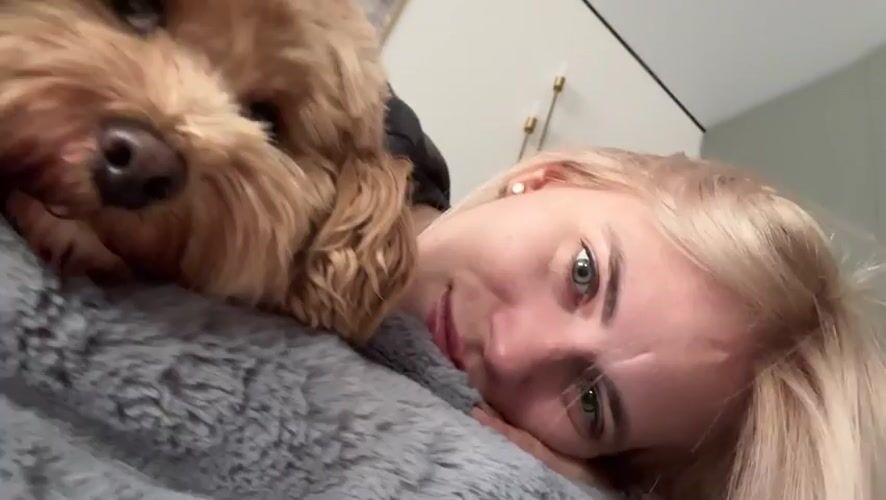 Woman and dog share quiet morning moment in Saratov