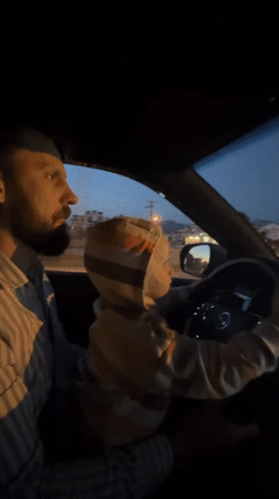 Father and child share quiet moment in car in Fethiye