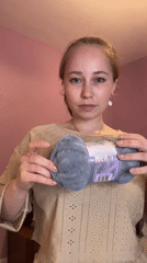 Woman handles yarn in Saint Petersburg apartment setting