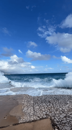 Waves crash against seawall in coastal Montenegro