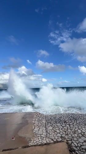 Waves crash against seawall in coastal Montenegro