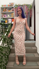 Woman poses for photo shoot on decorated stairs in Ljubljana