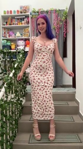 Woman poses for photo shoot on decorated stairs in Ljubljana