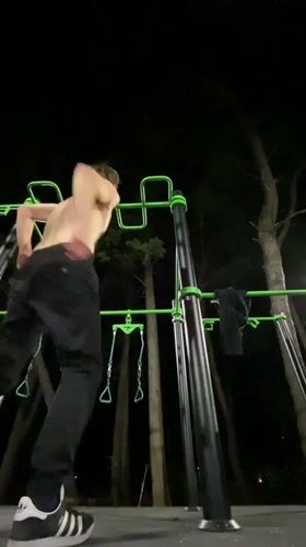 Man exercises at nighttime playground in Bar, Montenegro