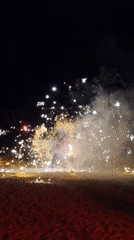 Nighttime fire performers stage pyrotechnic show on Thai beach