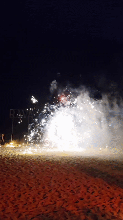 Nighttime fire performers stage pyrotechnic show on Thai beach
