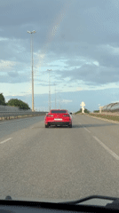 Red Camaro spotted on highway near Krasnodar during rainbow