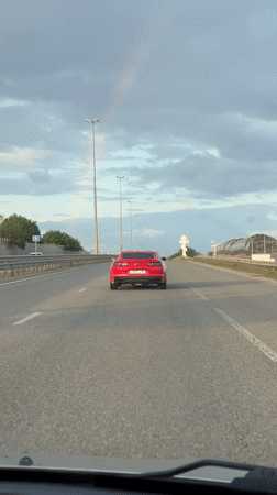 Red Camaro spotted on highway near Krasnodar during rainbow
