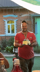 Family celebration with decorated cake held in Rozhdestveno, Russia