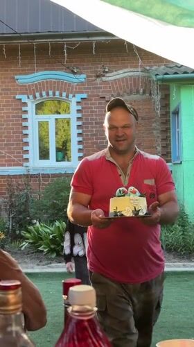 Family celebration with decorated cake held in Rozhdestveno, Russia