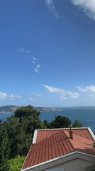 Visitor documents strawberry snack, coastal views in Šušanj Montenegro