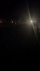 Three-wheeled vehicle spotted traveling at night on Nigerian road