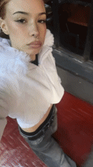 Woman in white fur jacket spotted on red surface in Buenos Aires