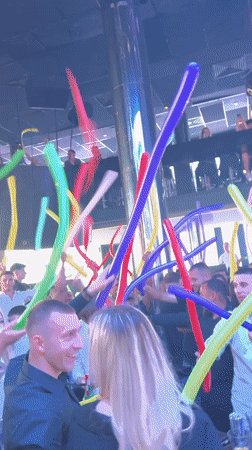 Nightclub balloon performance draws crowd participation in Nesebar, Bulgaria