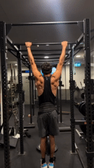 Man performs pull-ups at Bondi Beach area gym