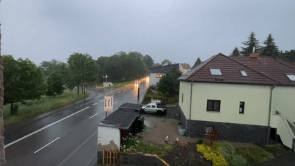 Rainy afternoon McDonald's meal observed from indoor residential window