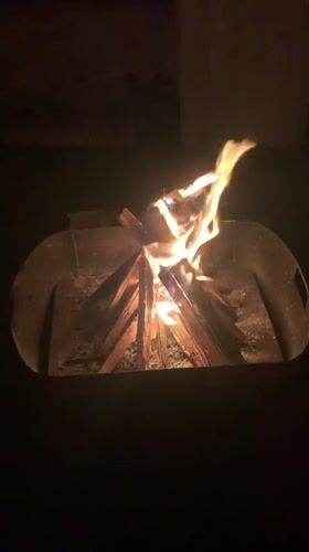 Campfire burning in a metal pit, Tabagrebi, Georgia