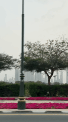 Dubai skyline captured on hazy afternoon featuring Burj Khalifa