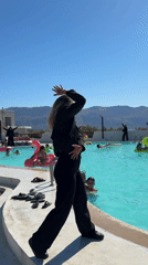 Resort staff run poolside dance and aerobics session in Sicily