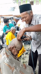 Aqiqah ceremony in Sanggrahan with livestock and ritual head-shaving