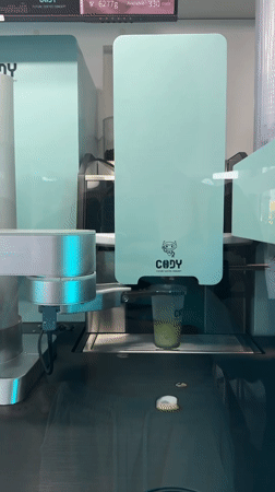 Robotic coffee machine dispenses green drinks in Puebla, Mexico