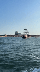 Black-sailed tall ship passes Venice's iconic waterfront