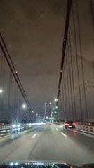 Night drive across suspension bridge captured in Lisbon