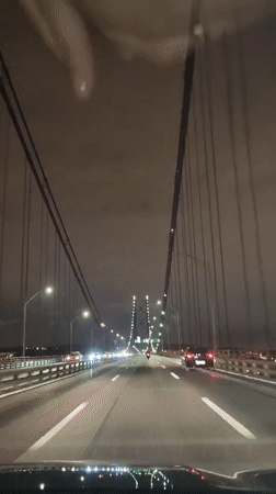Night drive across suspension bridge captured in Lisbon