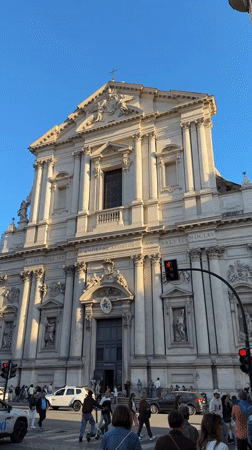 Crowds gather at ornate building in Rome