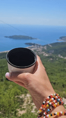 Person with travel mug and ice cream observed