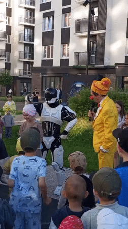 Costumed performers entertain children at Pervomaysky residential courtyard event