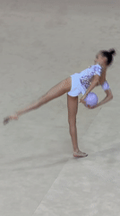 Rhythmic gymnast practices ball routine in Sofia training facility